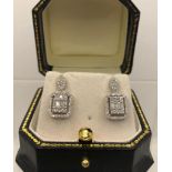 A PAIR OF ART DECO STYLE 18CT WHITE GOLD EARRINGS set with round and baguette cut diamonds drop 2cm