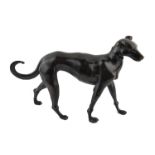 A CONTINENTAL BRONZE STATUE OF A HUNTING DOG In walking pose with a tail raised. (approx 32cm x