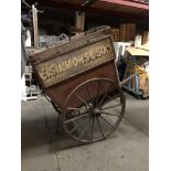 A LATE VICTORIAN WOODEN TRADESMAN COVERED HAND CART Branded E. Simmons and Son, iron bound spoke