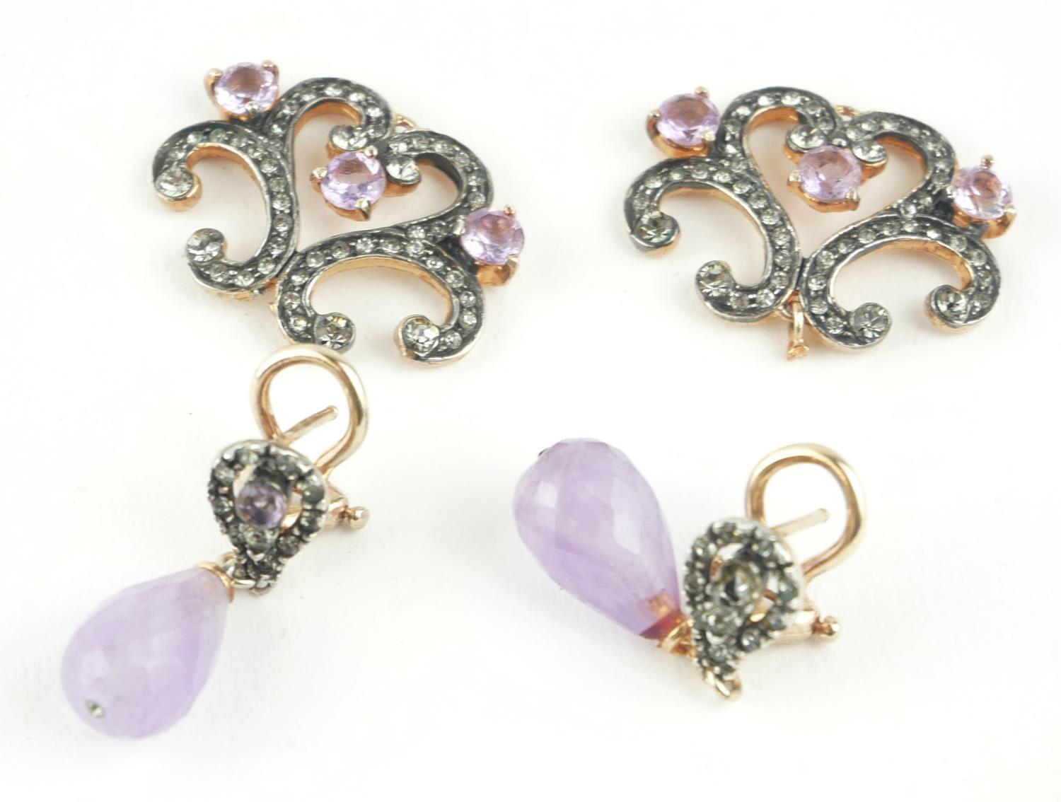 A PAIR OF 9CT GOLD, AMETHYST AND PASTE DROP EARRINGS Having faceted amethyst drops, together with