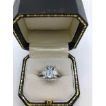 AN 18CT WHITE GOLD, AQUAMARINE AND DIAMOND RING (size N). (aquamarine approx 1.50ct)