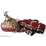 AN AFGHAN TURKMAN WOOL WITH WHITE METAL TRIBAL HEADDRESS Having a tassel finial, sewn with