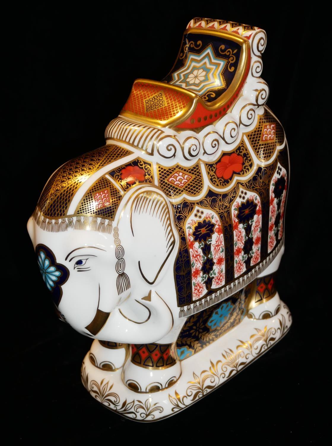ROYAL CROWN DERBY, A LARGE PORCELAIN ELEPHANT PAPERWEIGHT 'Standing Pose with Saddle', decorated - Image 3 of 3