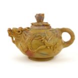 AN EARLY QING DYNASTY CHINESE SOAPSTONE DRAGON TEAPOT AND COVER The ovoid body with delicate spout