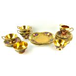 AYNSLEY, A VINTAGE PORCELAIN TEA SET Decorated with fruit, having gilt interior, marked 'Brunt',