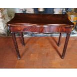 AN 18TH CENTURY MAHOGANY FOLD OVER SERPENTINE FORM CARD TABLE With green baize playing surface,