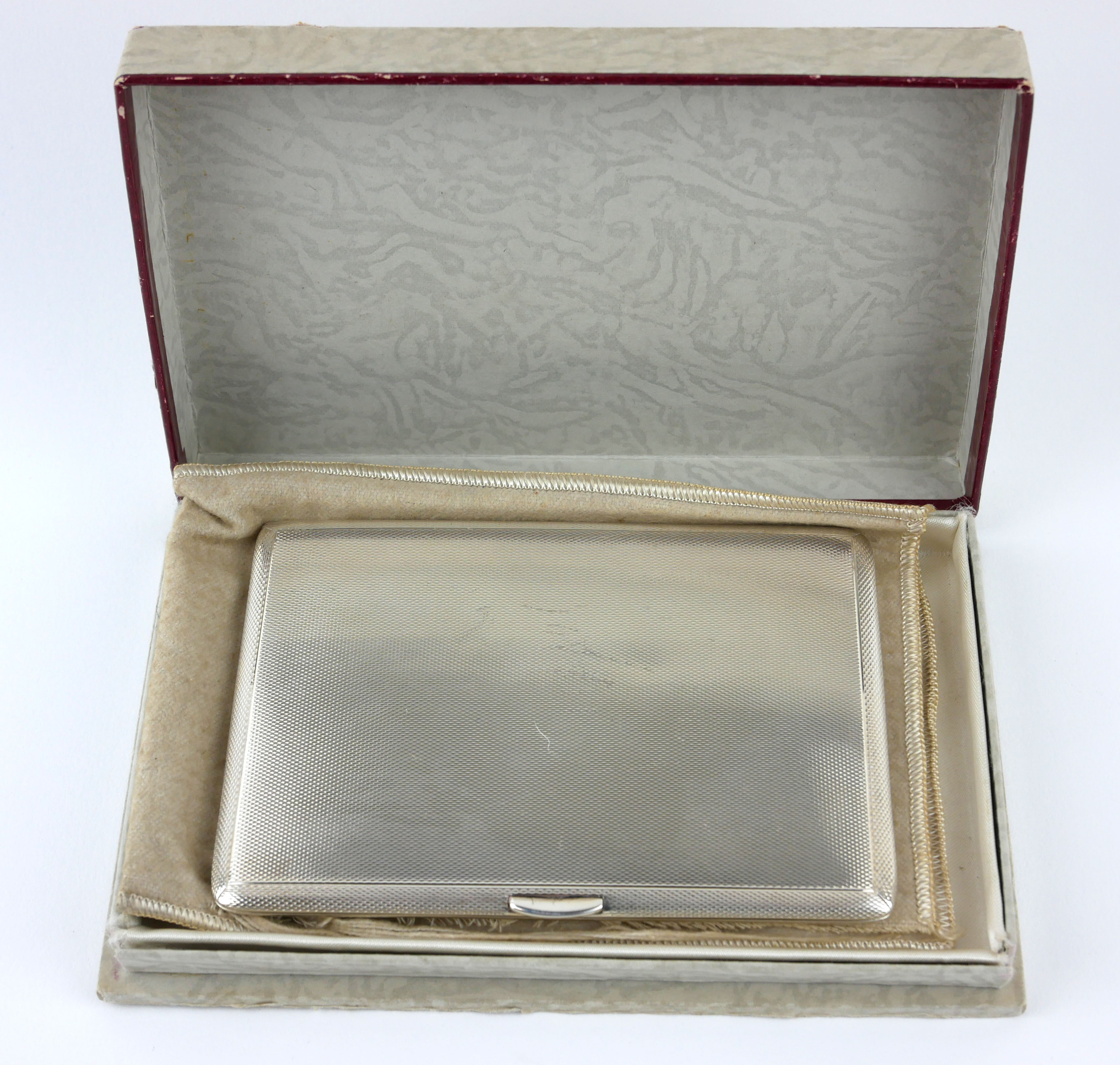 AN EARLY 20TH CENTURY SILVER CIGARETTE CASE Heavy gauge with engine turned decoration, hallmarked