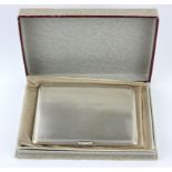 AN EARLY 20TH CENTURY SILVER CIGARETTE CASE Heavy gauge with engine turned decoration, hallmarked