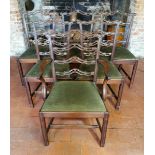 A SET OF SIX INCLUDING ONE CARVER LATE 19TH CENTURY MAHOGANY DINING CHAIRS With pierced ladder