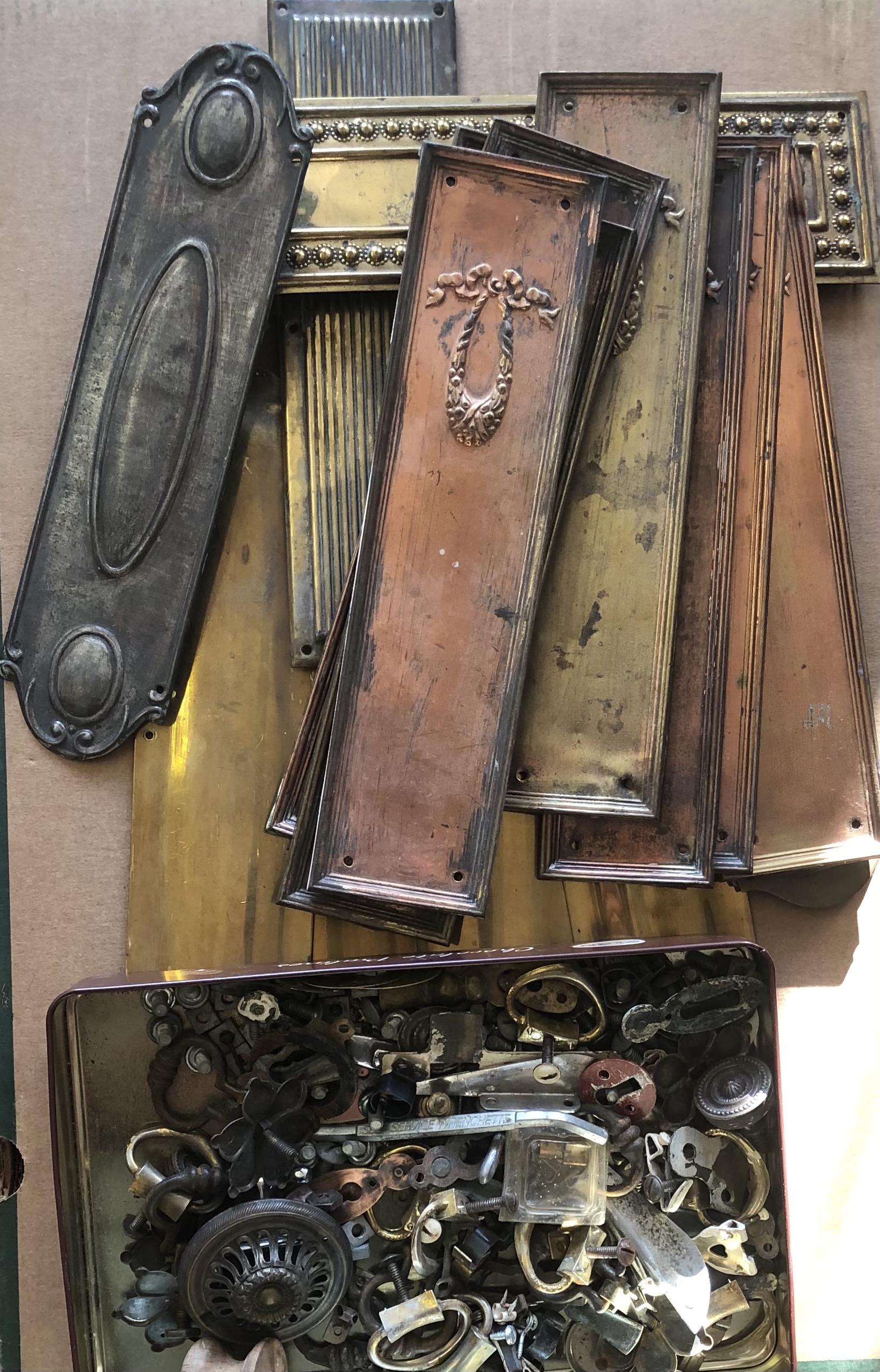 A COLLECTION OF SIXTEEN 19TH CENTURY BRASS DOOR PLATES Along with handles and fittings.