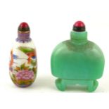 A CHINESE CARVED JADEITE AND HARDSTONE DOMED SNUFF BOTTLE With scrolled feet, together with a