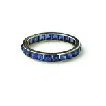 AN ART DECO PLATINUM AND SAPPHIRE FULL ETERNITY RING. (size M). (1.7g) Condition: good