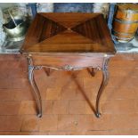 A LATE VICTORIAN MAHOGANY ENVELOPE CARD TABLE With concealed brown baize playing surface above a