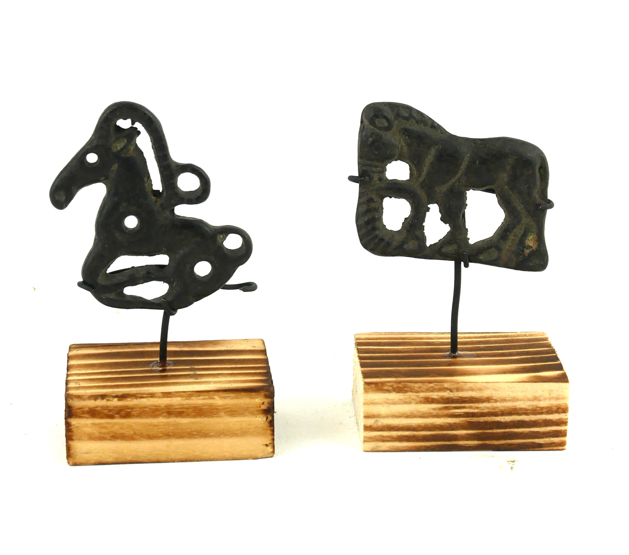 TWO CHINESE BRONZE EQUESTRIAN PLAQUES Casts as horses, on wood bases. (approx 5cm)