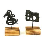 TWO CHINESE BRONZE EQUESTRIAN PLAQUES Casts as horses, on wood bases. (approx 5cm)