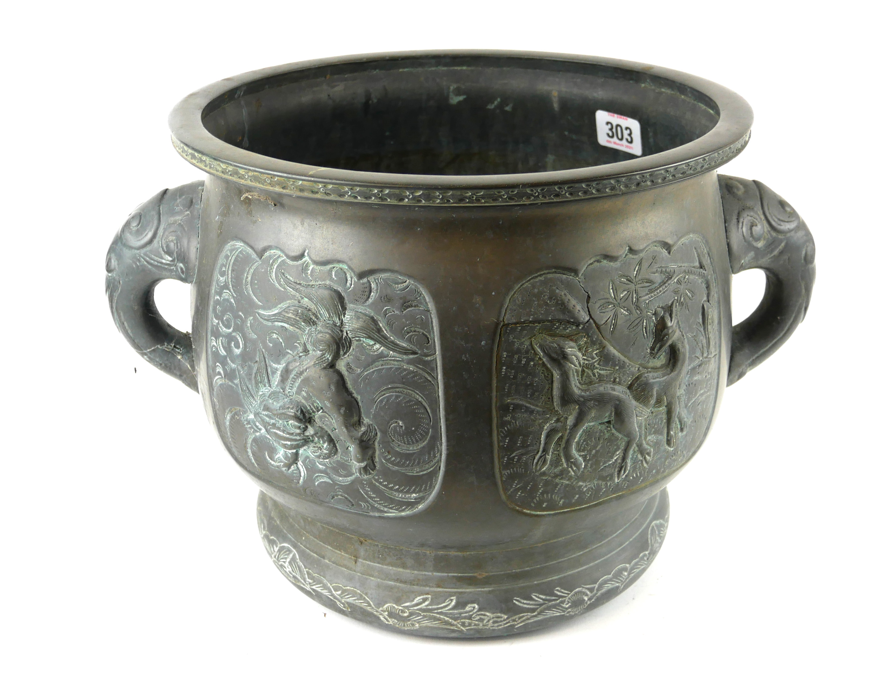 A 19TH/20TH ORIENTAL BRONZE JARDINIÈRE Decorated in relief with mythical beasts. (diameter 28cm x
