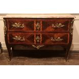 AN 18TH CENTURY FRENCH SERPENTINE COMMODE With rouge marble top above two drawers fitted with