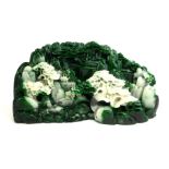 A CHINESE CARVED JADE CARVING, CONTINUOUS MOUNTAINOUS LANDSCAPE WITH EXOTIC TREES AND BUILDINGS. (