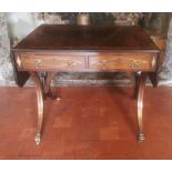 A REGENCY PERIOD MAHOGANY AND BRASS INLAID SOFA TABLE With real and false drawers, raised on swept