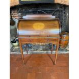 AN EDWARDIAN MAHOGANY AND MARQUETRY INLAID CYLINDER WRITING BUREAU Having a fitted interior above