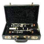 AN EARLY 20TH CENTURY VINTAGE BOOSEY & HAWKES EBONISED SIX KEY CLARINET In original black velvet