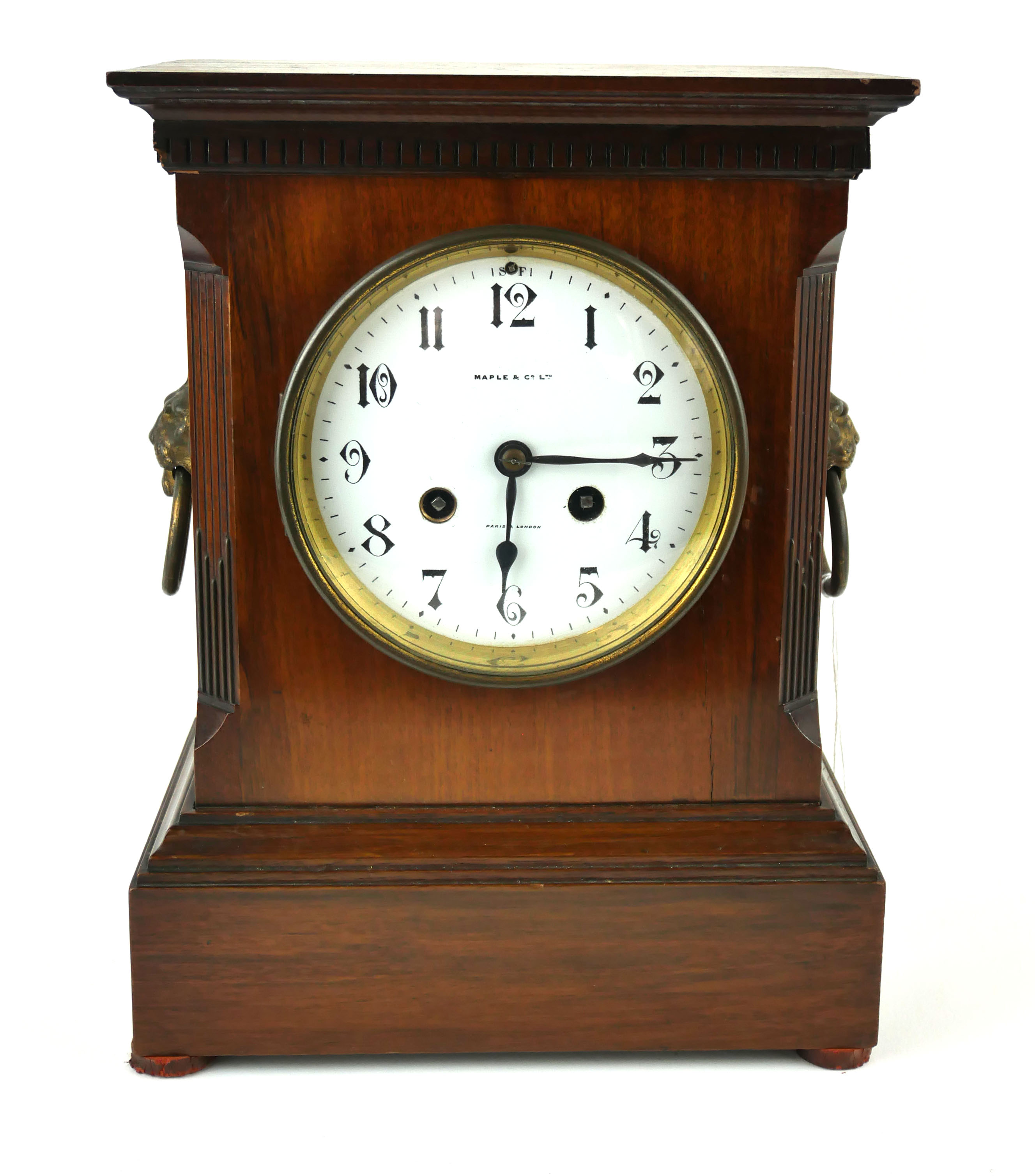 MAPLE AND CO., A LATE 19TH/EARLY 20TH CENTURY MANTLE CLOCK Architectural form with twin brass mask