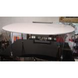 FRITZ HANSEN, DENMARK, 2002, A LARGE OVAL COFFEE TABLE White laminate with chrome banding and chrome