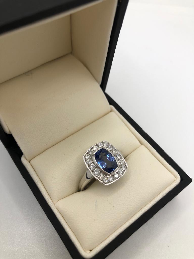 AN 18CT WHITE GOLD, SAPPHIRE AND DIAMOND RING (size O). (sapphire approx 1.80ct, diamond approx 0. - Image 2 of 3