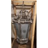 A LARGE AND IMPRESSIVE SILVER PLATED LANTERN The scroll foliage top above rams heads and six