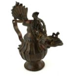 AN UNUSUAL INDIAN BRONZE HINDU FIGURAL OIL LAMP/EWER Cast with a figure of Ganesh, toad and mythical