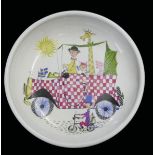 STIG LINDBERG, A MID 20TH CENTURY SWEDISH POTTERY DISH Figures with vintage cars, marked verso '