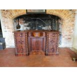 A VICTORIAN MAHOGANY DRESSER BASE With serpentine shaped drawer above cupboard flanked by drawers