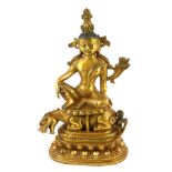 A NEPALESE GILT BRONZE SHIVA SHARABHA STATUE Seated on a temple lion, on double lotus form base. (