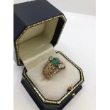 A VINTAGE 18CT GOLD, EMERALD AND DIAMOND RING, CIRCA 1970 (size Q). (emerald approx 1ct, diamond 0.