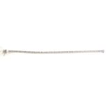 A WHITE GOLD AND DIAMOND TENNIS BRACELET Having a row of round cut diamonds. (approx total diamond