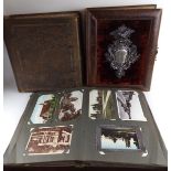 A COLLECTION OF VICTORIAN AND LATER POSTCARDS AND EPHEMERAL ITEMS A leather bound and white metal