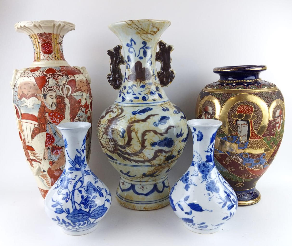 A COLLECTION OF 20TH CENTURY ORIENTAL POTTERY VASES Including a blue and white vase with twin
