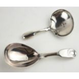 A KING WILLIAM IV SILVER CADDY SPOON The shaped bowl hallmarked Birmingham, 1836, together with a