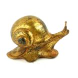 A JAPANESE GILT BRONZE SNAIL SCULPTURE Having a large shell to back and engraved decoration. (approx