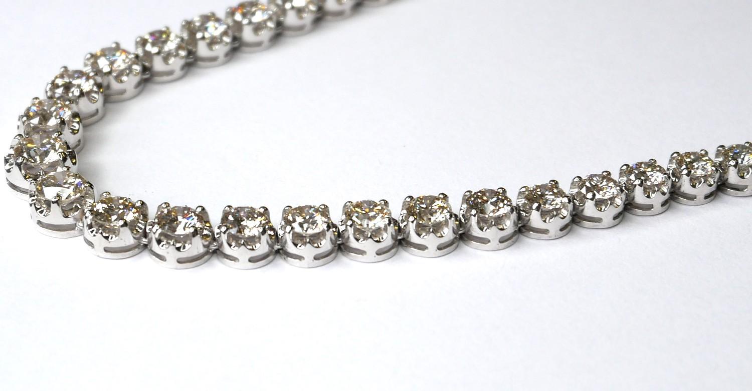 AN 18CT WHITE GOLD AND DIAMOND NECKLACE Having a single row of graduating round cut diamonds. ( - Image 2 of 3