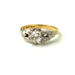 AN EARLY 20TH CENTURY 18CT GOLD AND PLATINUM OLD ROUND BRILLIANT CUT DIAMOND SOLITAIRE RING. (