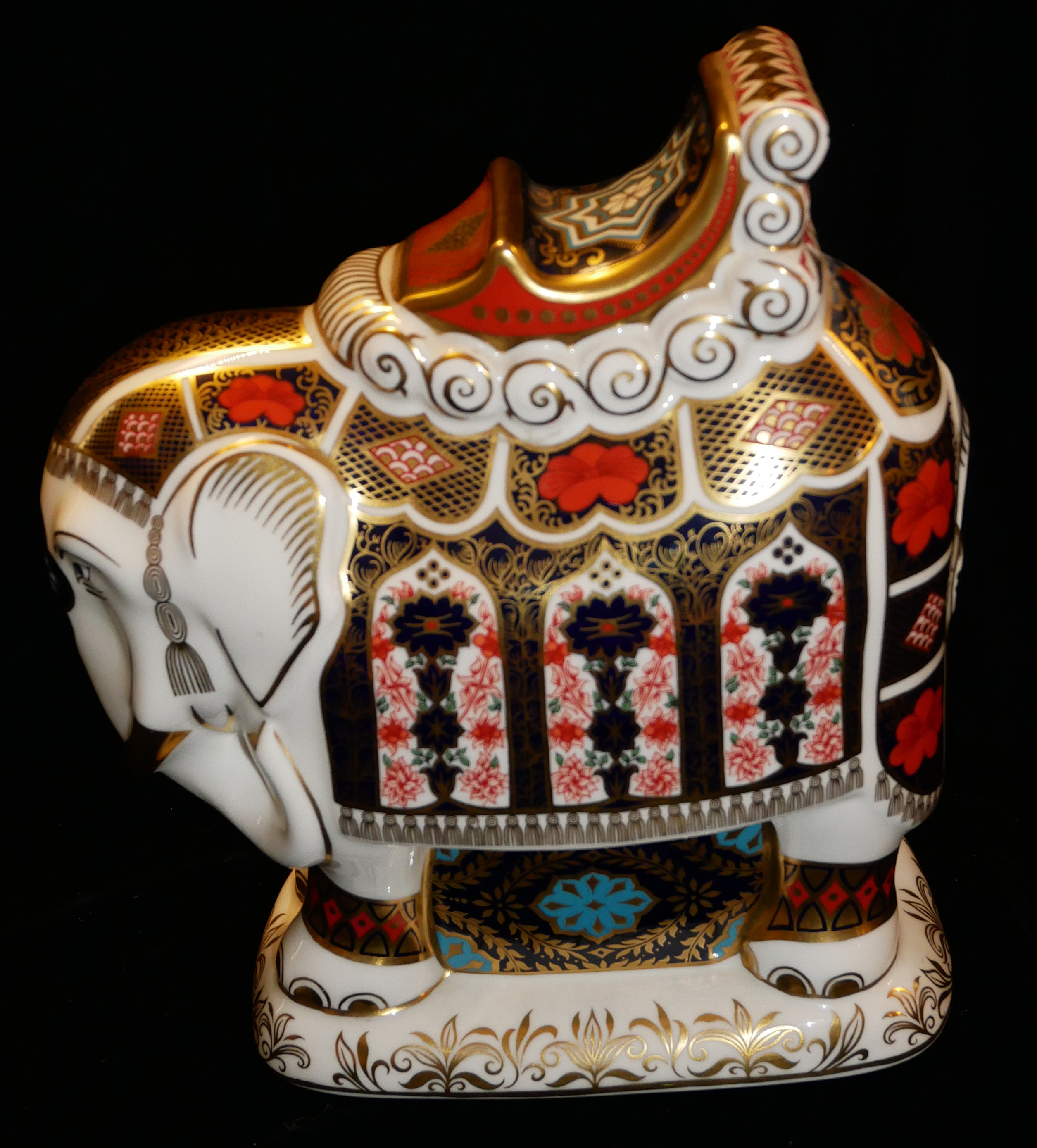 ROYAL CROWN DERBY, A LARGE PORCELAIN ELEPHANT PAPERWEIGHT 'Standing Pose with Saddle', decorated