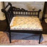A VICTORIAN MAHOGANY WINDOW SEAT With turned galleried back, floral fabric upholstered seat,