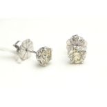 A PAIR OF 18CT WHITE GOLD AND DIAMOND STUD EARRINGS Each set with a single round cut diamond. (