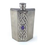 AN ARTS AND CRAFTS DESIGN PEWTER HIP FLASK Set with a cabochon cut stone and celtic firm band,
