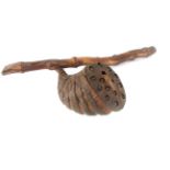 A LARGE CHINESE SEED NUT RATTLE With fifteen nut seeds in a burr wood pod. (pod approx 16cm)