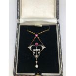 AN 18CT GOLD, RUBY, DIAMOND AND PEARL PENDANT, CIRCA 1920.