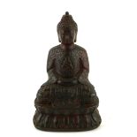 A TIBETAN BRONZE BUDDHA STATUE Wearing elaborate robes and double lotus base, bearing a four