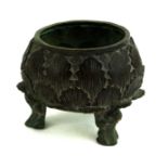 A CHINESE BRONZE CENSER With concentric bands of leaf decoration and toad form tripod legs,