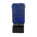 A CARVED LAPIS LAZULI BUDDHA PLAQUE Carved in relief with a Buddha seated on a double lotus base, on